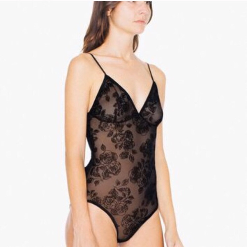 Black bodysuit with rose detailing.